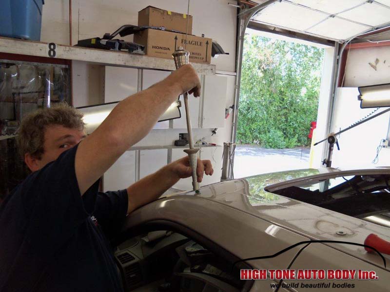 Removing dents without any auto body work for a quick and affordable auto body repair